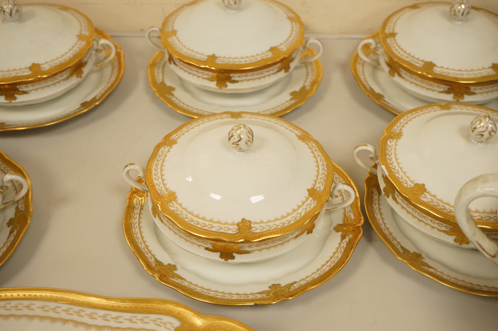 A Haviland Limoges dinner service with gilt border
